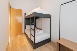Postel nebo postele na pokoji v ubytování Petit Luxe Ègara