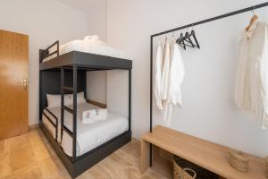 Postel nebo postele na pokoji v ubytování Petit Luxe Ègara