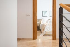 Postel nebo postele na pokoji v ubytování Petit Luxe Ègara