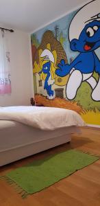 Postel nebo postele na pokoji v ubytování Brilliant Apartman