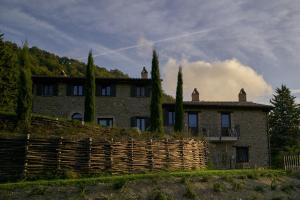 a large house with a fence in front of it at Incantico "Eco Resort" in Assisi