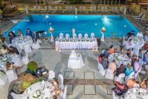 an overhead view of a wedding ceremony in a pool at Grecian Castle Chios in Chios