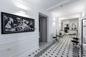 a room with a black and white checkered floor at La Canea Canvas 1 in Chania
