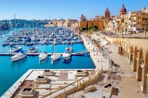 a harbor filled with lots of boats in the water at Historic Townhouse in Birgu Center in Vittoriosa