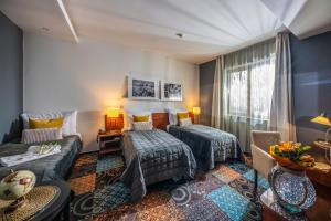 Posteľ alebo postele v izbe v ubytovaní Budapest Airport Hotel Stáció Wellness & Konferencia