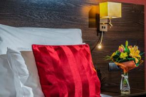 Posteľ alebo postele v izbe v ubytovaní Budapest Airport Hotel Stáció Wellness & Konferencia
