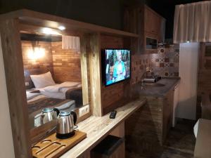 A television and/or entertainment centre at THE SARIGERME INN
