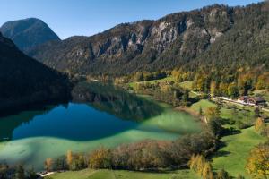an aerial view of a lake in the mountains at Klosterhof – Alpine Hideaway & Spa in Bad Reichenhall