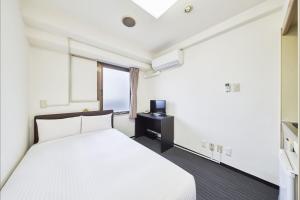 FLEXSTAY  東十條旅館房間的床