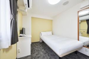 FLEXSTAY  東十條旅館房間的床