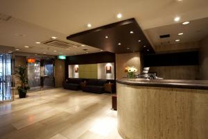 a lobby with a bar and a waiting room at the b sangenjaya in Tokyo
