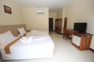 Postel nebo postele na pokoji v ubytování Phangan Island View - SHA Extra Plus