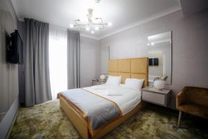 Postel nebo postele na pokoji v ubytování Royal Class Hotel + 37 fotografií