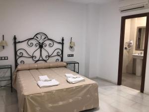 Voodi või voodid majutusasutuse Hostal Almanzor toas