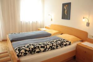 Posteľ alebo postele v izbe v ubytovaní Appartement Prieth