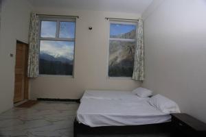 Postel nebo postele na pokoji v ubytování Junction Resort