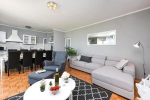 a living room with a couch and a table at Villa Elder ZadarVillas in Donji Lepuri +19 photos