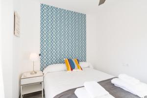 Posteľ alebo postele v izbe v ubytovaní Berlanga, apartamento en el centro