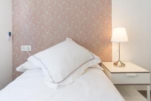 Posteľ alebo postele v izbe v ubytovaní Berlanga, apartamento en el centro