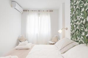 Posteľ alebo postele v izbe v ubytovaní Berlanga, apartamento en el centro