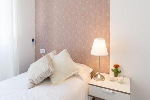 Posteľ alebo postele v izbe v ubytovaní Berlanga, apartamento en el centro