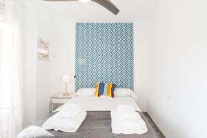 Posteľ alebo postele v izbe v ubytovaní Berlanga, apartamento en el centro