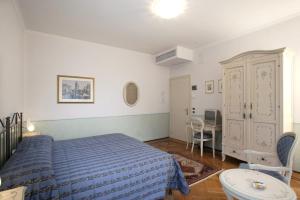 Postel nebo postele na pokoji v ubytování Ca' San Rocco