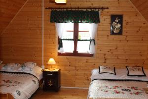 Postel nebo postele na pokoji v ubytování Zagroda Górska na Zobawie