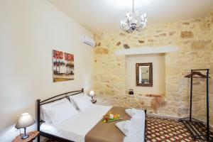 A bed or beds in a room at Michalis Stonehouse