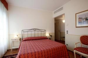 Postel nebo postele na pokoji v ubytování Ca' San Rocco