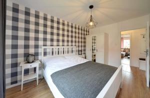 Posteľ alebo postele v izbe v ubytovaní Apart-Invest Apartament Pastelowy