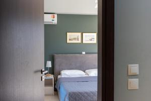 Posteľ alebo postele v izbe v ubytovaní Villa Oliva Rodos