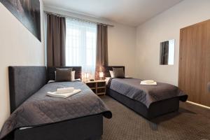 Ένα ή περισσότερα κρεβάτια σε δωμάτιο στο HOTEL LUBLIN