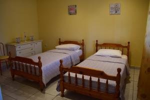 A bed or beds in a room at AMISIANA HOUSE