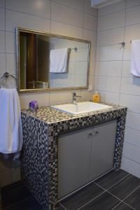 A bathroom at AMISIANA HOUSE