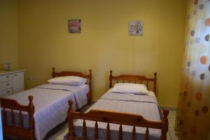 A bed or beds in a room at AMISIANA HOUSE