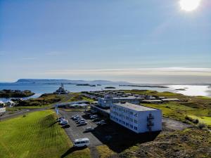 an aerial view of a parking lot next to the water at Fosshotel Stykkisholmur in Stykkishólmur