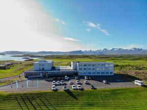 an aerial view of a building with a parking lot at Fosshotel Stykkisholmur in Stykkishólmur