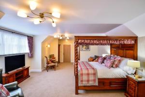 a bedroom with a bed and a dresser at The Coach and Horses in Worthing