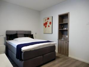 Ein Bett oder Betten in einem Zimmer der Unterkunft Hôtel de l'Ecluse