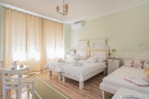 Postel nebo postele na pokoji v ubytování Shabby Chic Apartments