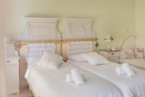 Postel nebo postele na pokoji v ubytování Shabby Chic Apartments