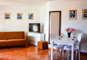 a living room with a table and a couch at Przystań przy plaży in Władysławowo