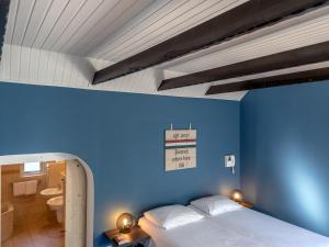 Кровать или кровати в номере Koetshuis Nunspeet