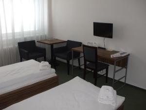 Postel nebo postele na pokoji v ubytování Hotel Veronika