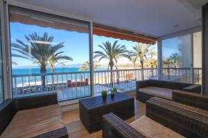 a living room with a view of the ocean at DIFFERENTFLATS Altair in Salou