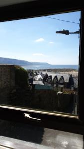 a view of a city from a window at Penbryn Holidays No 2 in Barmouth +6 photos