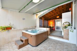 a hot tub in the middle of a patio at Old Town Jacuzzi Suite in Zadar