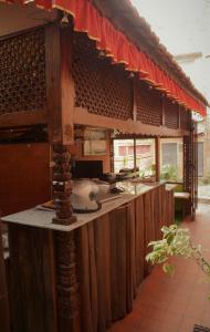 a kitchen with a counter with a counter top at Inn Sangrahalaya in Bhaktapur