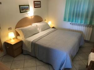 Postel nebo postele na pokoji v ubytování Hotel B&B Rispescia Grosseto